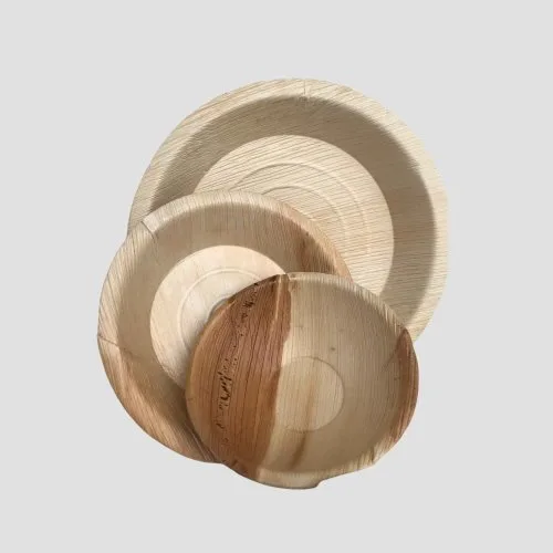 Round palm leaf plates with natural grain