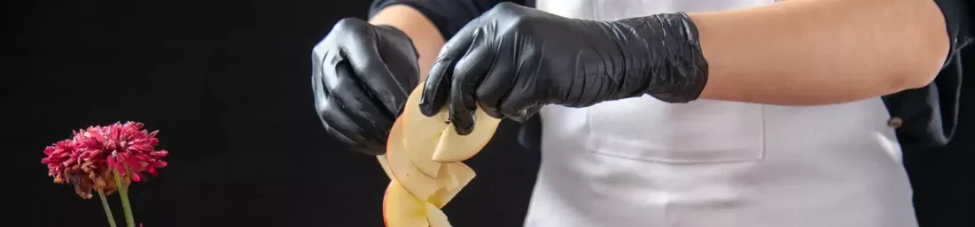 Food service staff wearing gloves and hair nets